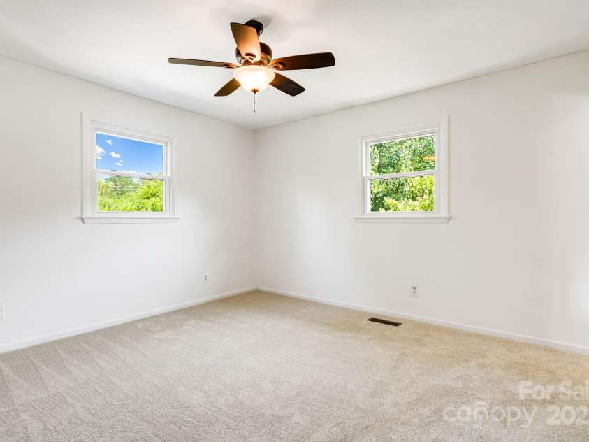 1360 Jupiter Road, Weaverville, NC 28787.  MLS# CAR4276296, YatesRealty ID 26556. Primary Bedroom Main Floor