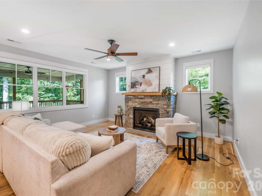 9 Ashe Park Circle, Asheville, NC 28806.  MLS# CAR4377416, YatesRealty ID 26564. Living room with gas logs.