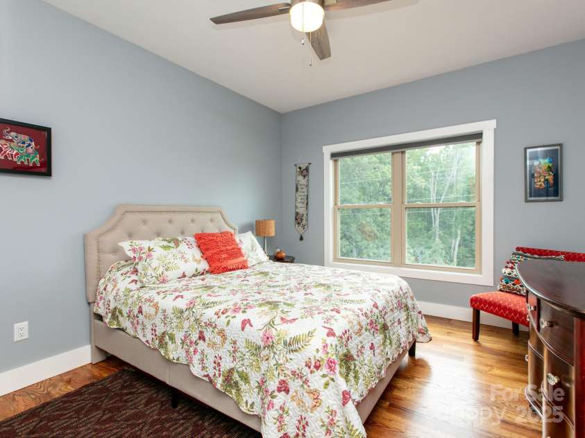 5 Pine Drive, Weaverville, NC 28787.  MLS# CAR4257819, YatesRealty ID 26567. Guest bedroom 1 with the beautiful red maple wood floors