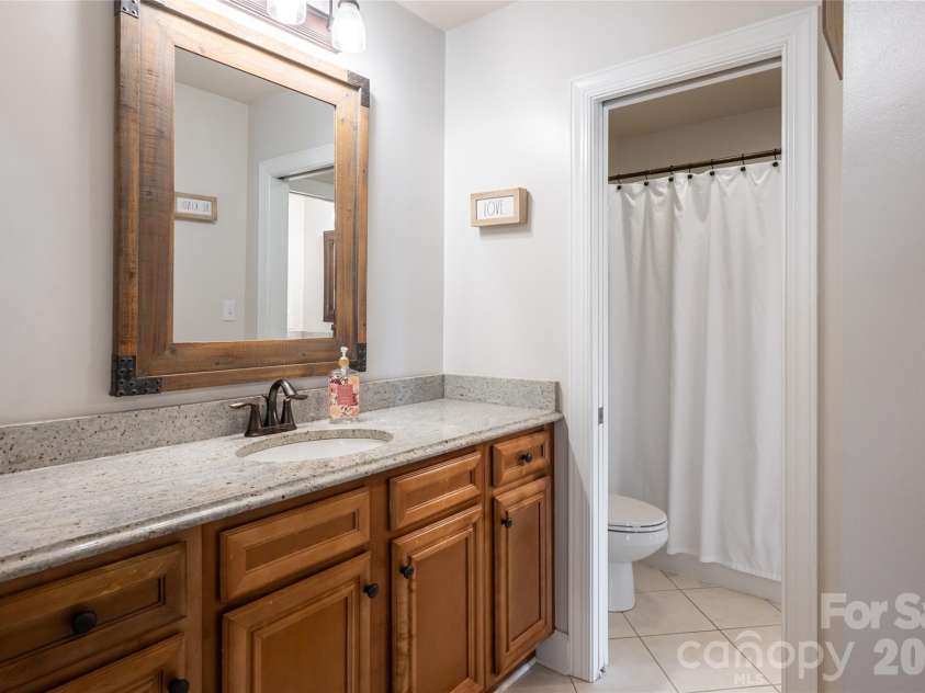 75 Ledgestone Drive, Fairview, NC 28730.  MLS# CAR4371731, YatesRealty ID 26567. Shares a jack and jill bathroom with ....