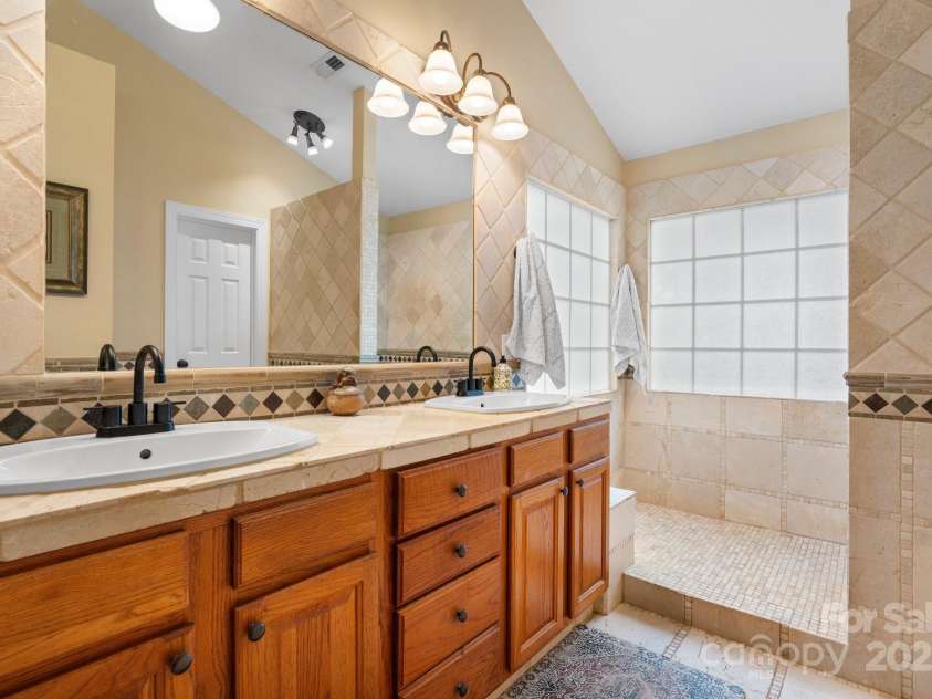 4007 Lake Shore Road, Denver, NC 28037.  MLS# CAR4271111, YatesRealty ID 26569. Primary bath has a large walk-in shower