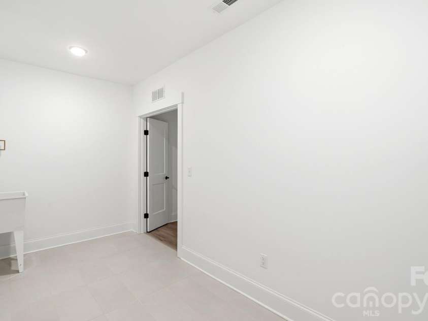 825 Breezewood Drive, Charlotte, NC 28262.  MLS# CAR4384219, YatesRealty ID 26571. Laundry Area