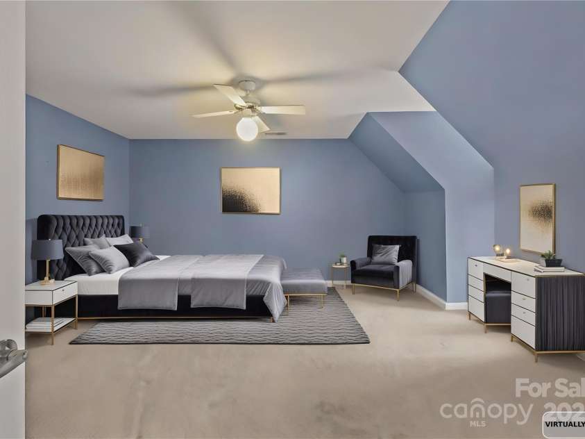 10217 Linksland Drive, Huntersville, NC 28078.  MLS# CAR4281355, YatesRealty ID 26573. Bedroom currently used as a home gym virtually staged as a bedroom.