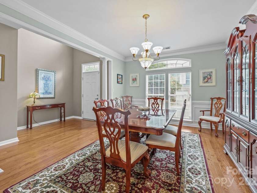 10217 Linksland Drive, Huntersville, NC 28078.  MLS# CAR4281355, YatesRealty ID 26573. Formal dining room with open sight lines to the foyer features generous millwork, new hardwood floors, French-style windows, neutral paint.