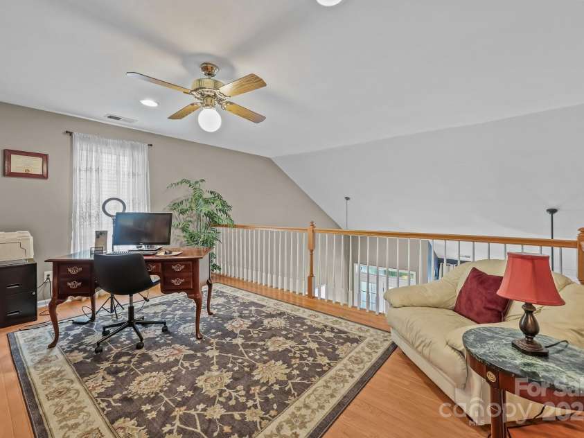 10217 Linksland Drive, Huntersville, NC 28078.  MLS# CAR4281355, YatesRealty ID 26573. Loft is an outstanding flex space that can easily be used as a home office, cozy library, game room, or whatever suits your lifestyle best.