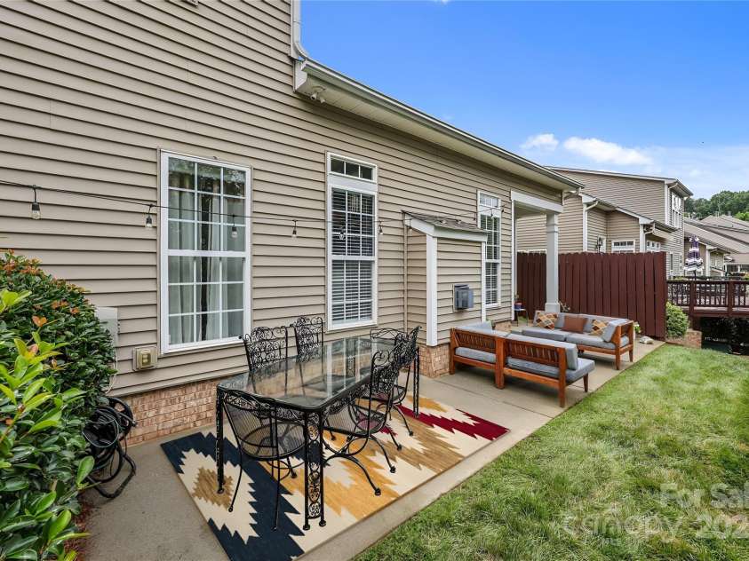 10217 Linksland Drive, Huntersville, NC 28078.  MLS# CAR4281355, YatesRealty ID 26573. Patio features room for sitting and relaxing, al fresco dining, grilling, making it an ideal outdoor retreat for gatherings and everyday enjoyment.