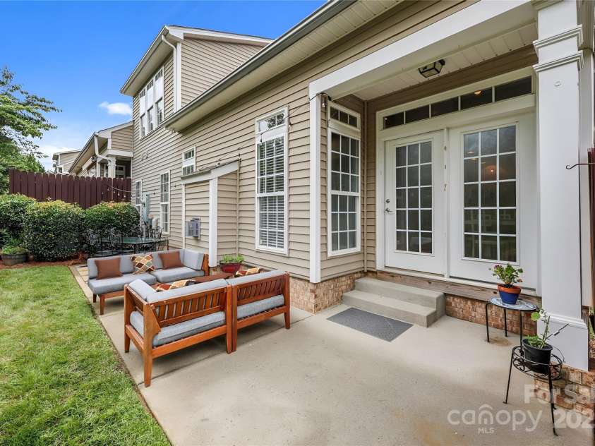 10217 Linksland Drive, Huntersville, NC 28078.  MLS# CAR4281355, YatesRealty ID 26573. Patio is accessed via a glass-paned door in the home's breakfast area. Great flow when entertaining.