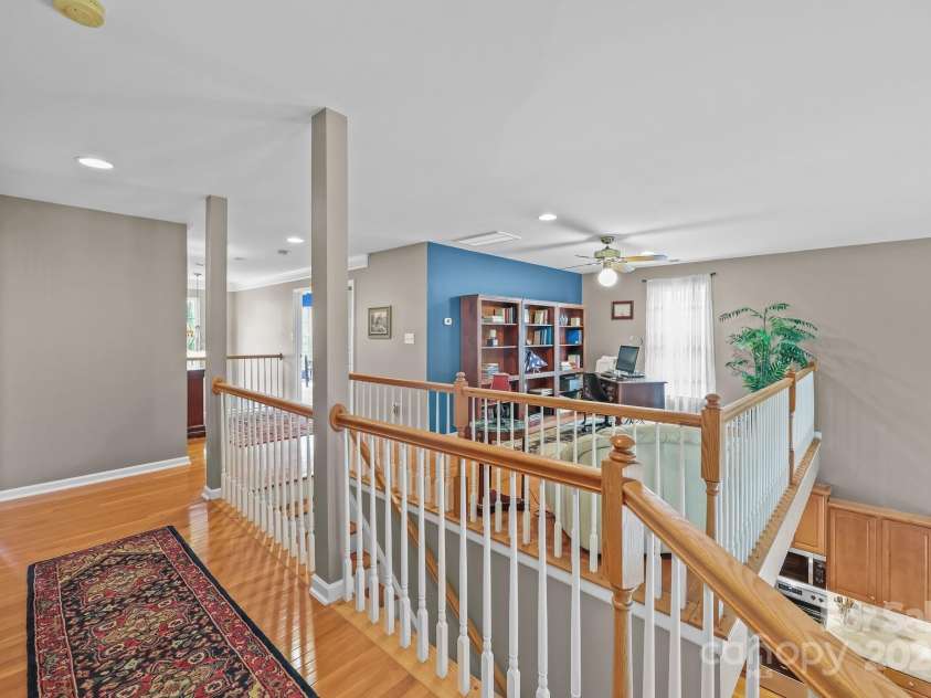10217 Linksland Drive, Huntersville, NC 28078.  MLS# CAR4281355, YatesRealty ID 26573. Second floor landing overlooks the main floor, offering an open, airy view enhancing the home's spacious and connected feel.
