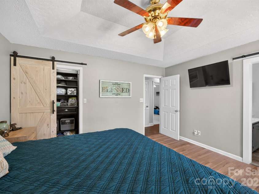 106 Abbey Circle, Salisbury, NC 28147.  MLS# CAR4272995, YatesRealty ID 26574. Primary Bedroom, barn door & plank flooring!