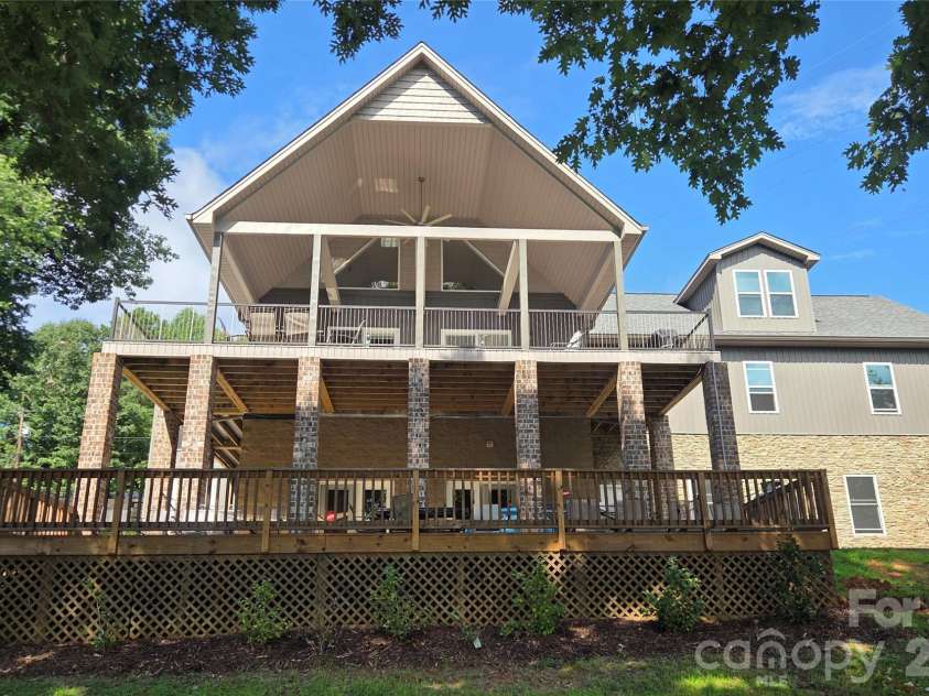 393 Stillwater Road, Troutman, NC 28166.  MLS# CAR4384450, YatesRealty ID 26574. Lake side view