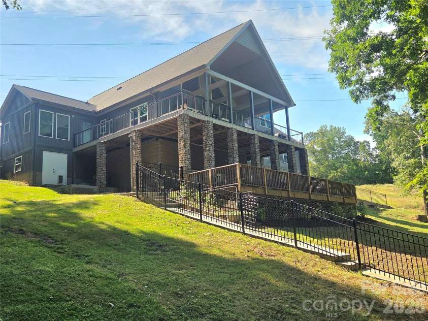 393 Stillwater Road, Troutman, NC 28166.  MLS# CAR4384450, YatesRealty ID 26574. Lakeside view