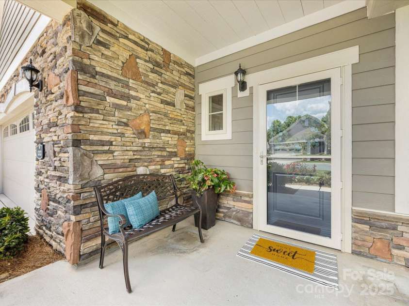 1313 Haywood Park Drive, Waxhaw, NC 28173.  MLS# CAR4279018, YatesRealty ID 26575. Extended Covered Front Porch with Stone Accents & Detailed Trim – Perfect for Welcoming Guests Rain or Shine!