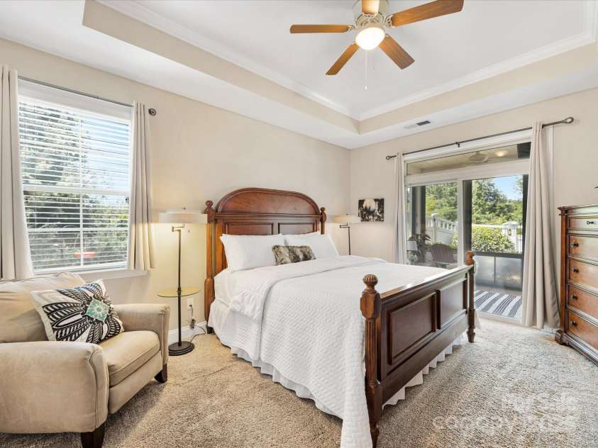 1313 Haywood Park Drive, Waxhaw, NC 28173.  MLS# CAR4279018, YatesRealty ID 26575. Oversized Primary Bedroom with Tray Ceilings, Detailed Molding, Fresh Paint & Private Access to Screened Porch.