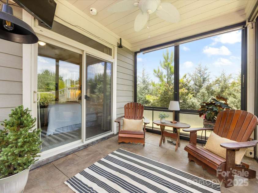 1313 Haywood Park Drive, Waxhaw, NC 28173.  MLS# CAR4279018, YatesRealty ID 26575. Upgraded Screened Porch off Primary Bedroom with Slide-Down Screens & Clear Panels for Year-Round Enjoyment