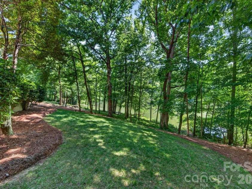 5424 Gorham Drive, Charlotte, NC 28226.  MLS# CAR4381431, YatesRealty ID 26575. Rear yard overlooking lake