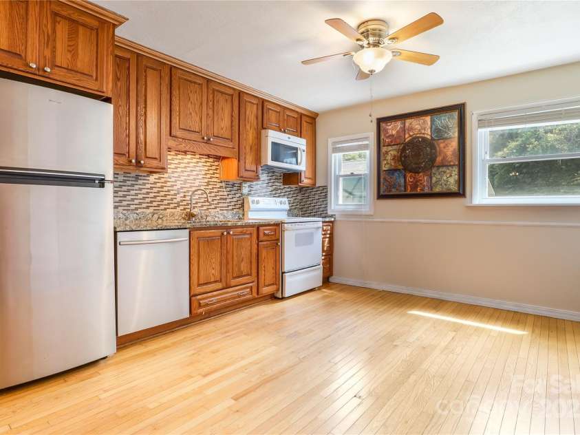 13 Rosscraggon Drive, Asheville, NC 28803.  MLS# CAR4260908, YatesRealty ID 26581. Kitchen Area (Electric Panel box behind Framed Art)