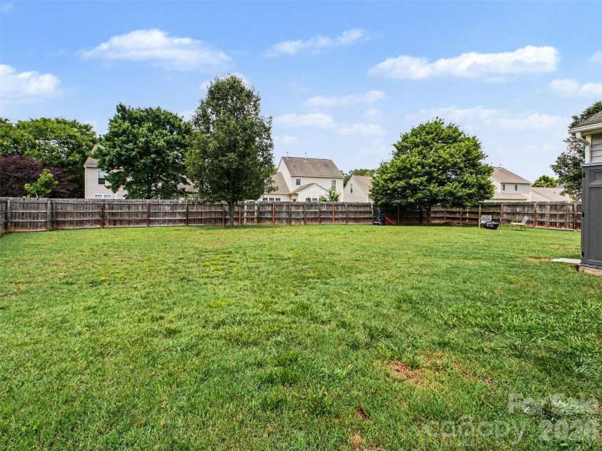 156 Barrington Drive, Mount Holly, NC 28120.  MLS# CAR4386064, YatesRealty ID 26591. Back Yard