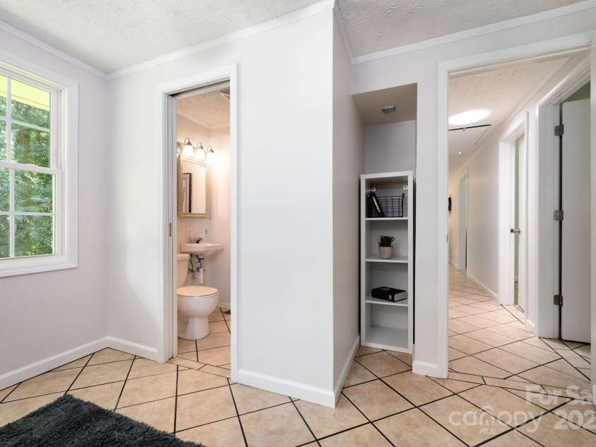 35 Pope Road, Brevard, NC 28712.  MLS# CAR4261354, YatesRealty ID 26591. Office Bathroom