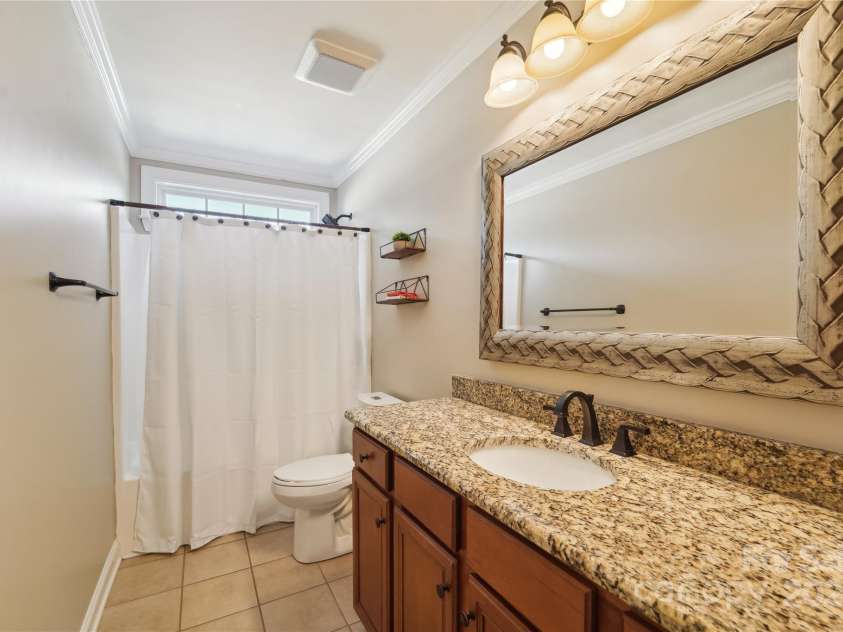 1237 Saint Johns Avenue, Matthews, NC 28104.  MLS# CAR4273618, YatesRealty ID 26593. Upstairs Bathroom
