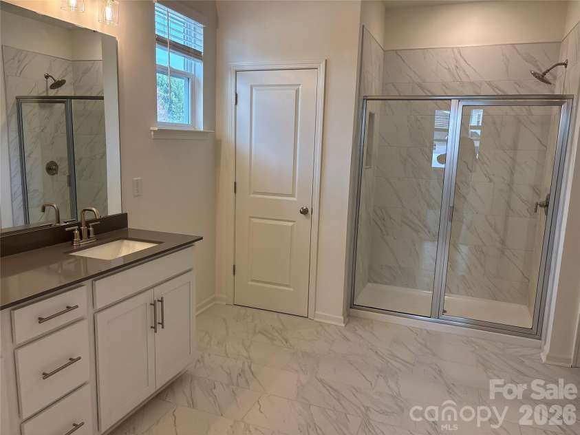 1210 Daniel Pine Drive, Indian Land, SC 29707.  MLS# CAR4326552, YatesRealty ID 26595. Beautiful large Primary bath with dual sinks at vanity.
