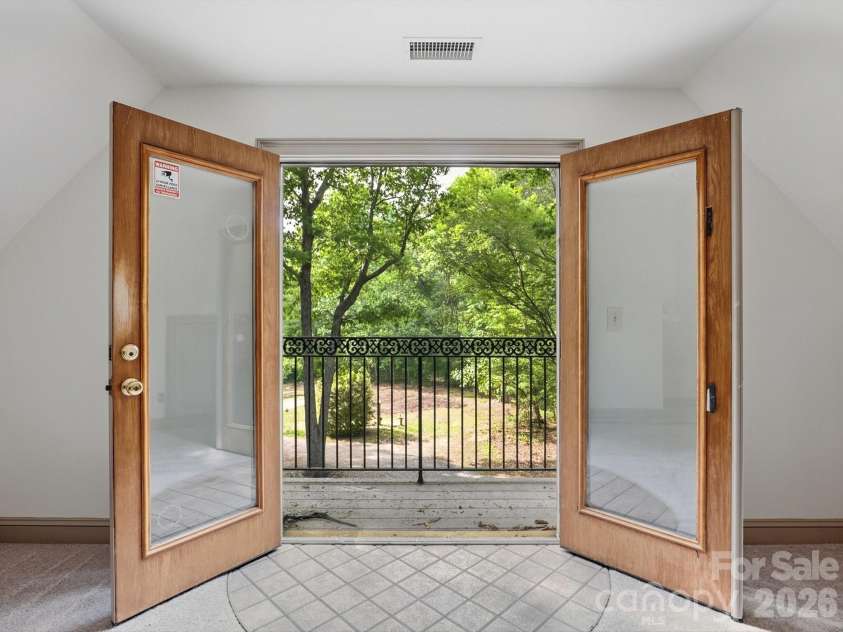 6717 Mccain Boulevard, Waxhaw, NC 28173.  MLS# CAR4372669, YatesRealty ID 26599. Doors to balcony in bed/bonus
