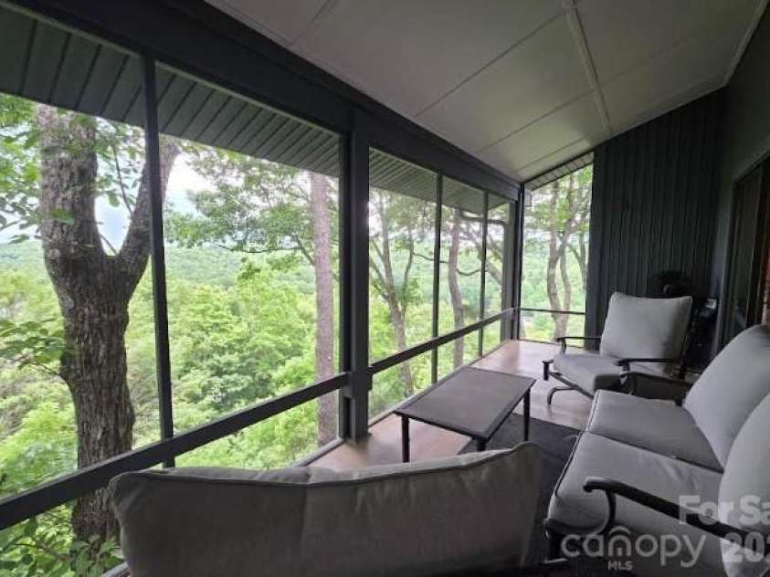 283 Tinequa Drive, Brevard, NC 28712.  MLS# CAR4369072, YatesRealty ID 26605. Back balcony 