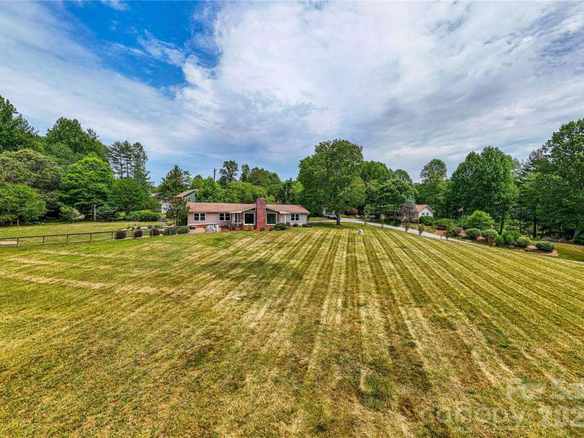 15 Bowman Ridge Road, Hendersonville, NC 28739.  MLS# CAR4369770, YatesRealty ID 26608. Land/Front Yard