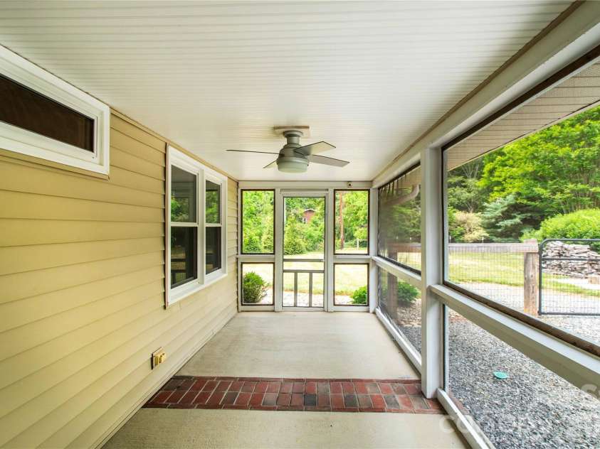 15 Bowman Ridge Road, Hendersonville, NC 28739.  MLS# CAR4369770, YatesRealty ID 26608. Screened Porch
