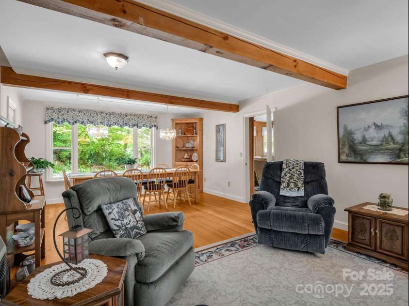 150 Marcellina Drive, Fairview, NC 28730.  MLS# CAR4279667, YatesRealty ID 26611. Dining area and sitting room.