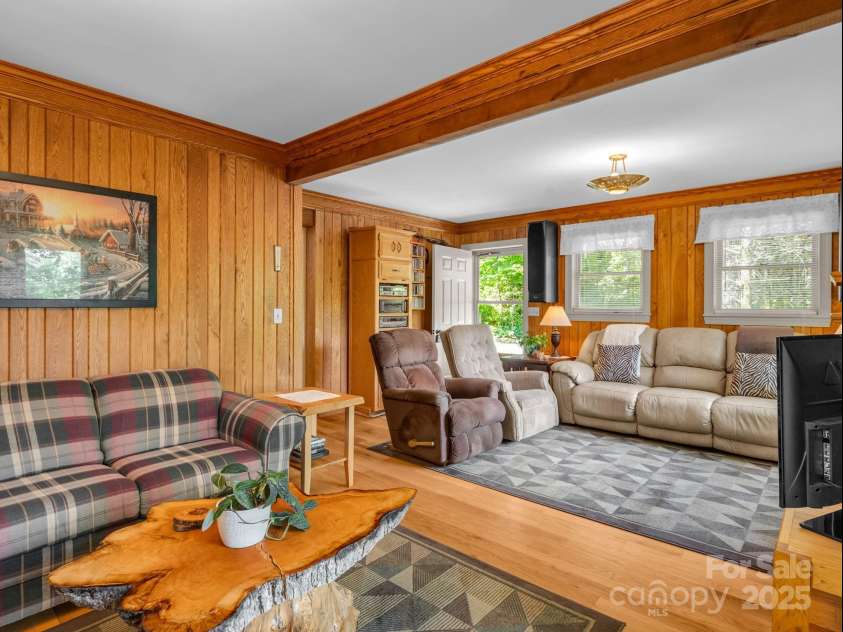 150 Marcellina Drive, Fairview, NC 28730.  MLS# CAR4279667, YatesRealty ID 26611. Living room with picture window to enjoy the long range views.