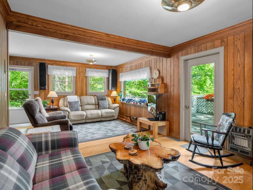 150 Marcellina Drive, Fairview, NC 28730.  MLS# CAR4279667, YatesRealty ID 26611. Living room with picture window to enjoy the long range views.