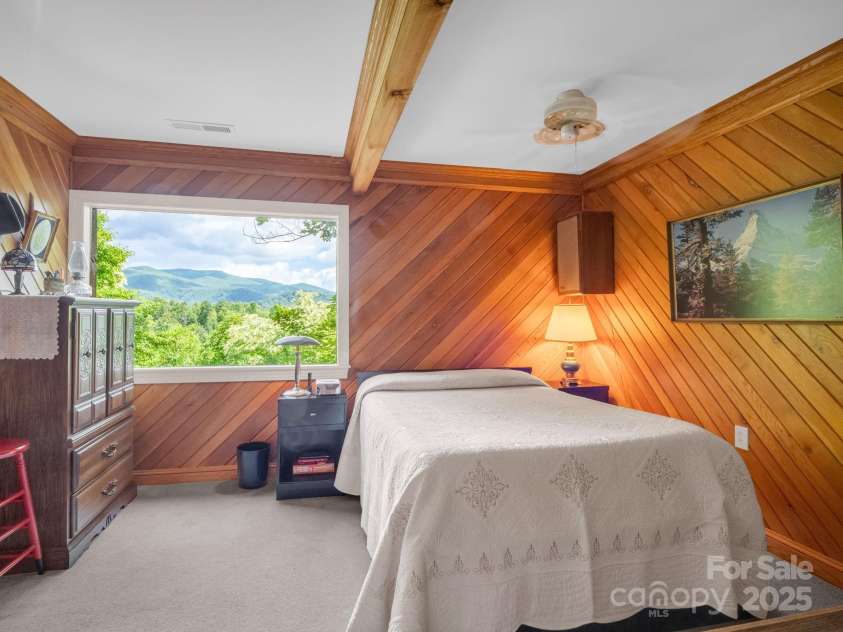 150 Marcellina Drive, Fairview, NC 28730.  MLS# CAR4279667, YatesRealty ID 26611. Primary bedroom with picture window to enjoy the long range views.