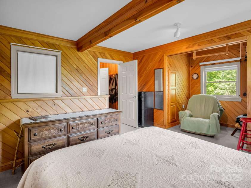 150 Marcellina Drive, Fairview, NC 28730.  MLS# CAR4279667, YatesRealty ID 26611. Primary bedroom with picture window to enjoy the long range views.