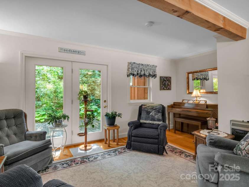 150 Marcellina Drive, Fairview, NC 28730.  MLS# CAR4279667, YatesRealty ID 26611. Sitting room with 2nd patio area