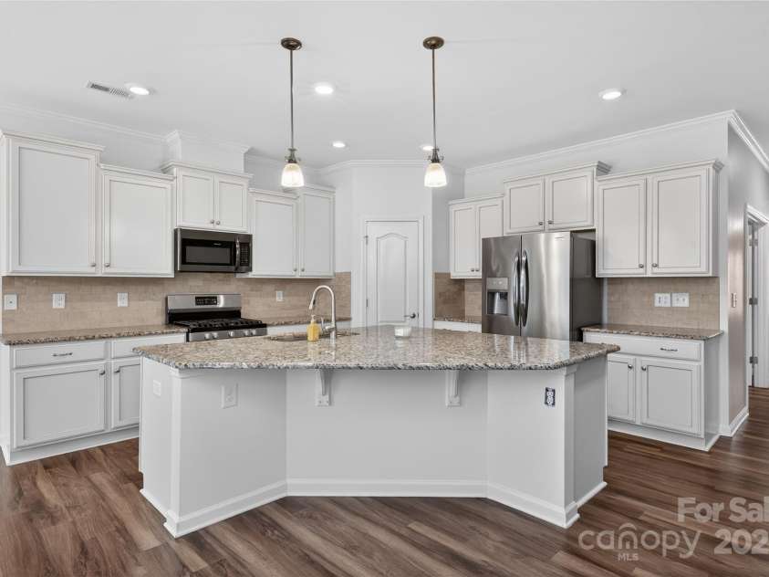 4057 Channel Islands Way, Lancaster, SC 29720.  MLS# CAR4292453, YatesRealty ID 2662. Bright white kitchen with FRESH paint!