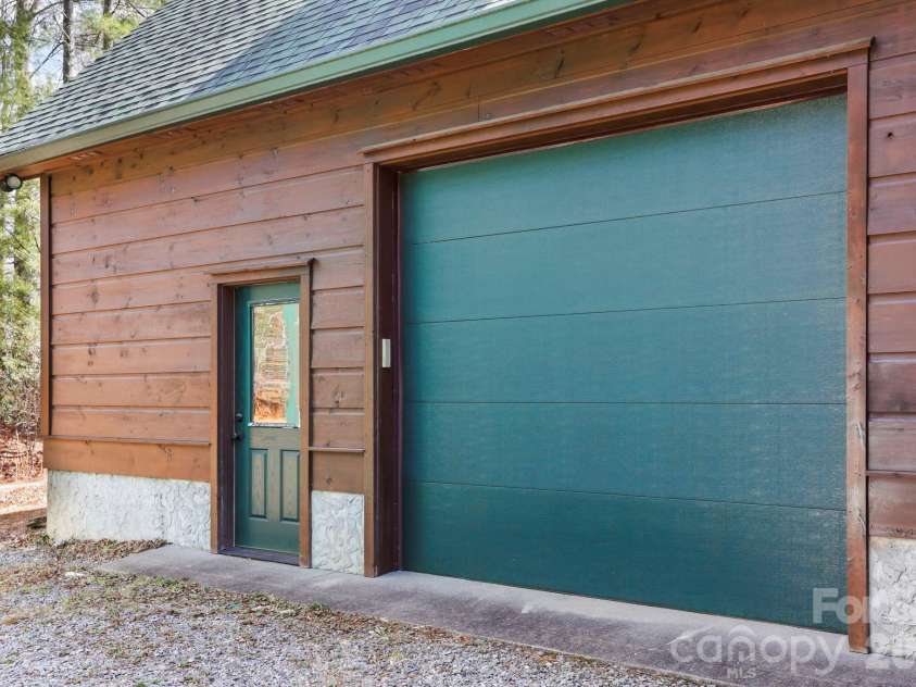 213 Big Valley Road, Pisgah Forest, NC 28768.  MLS# CAR4353319, YatesRealty ID 26629. Attached car garage