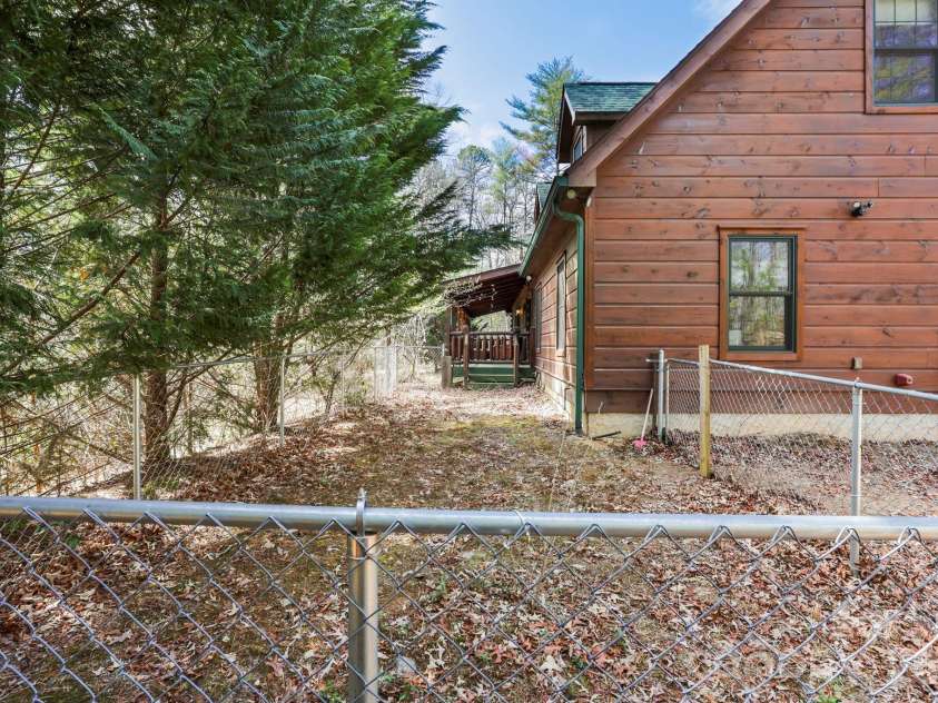 213 Big Valley Road, Pisgah Forest, NC 28768.  MLS# CAR4353319, YatesRealty ID 26629. Fenced side yard for pets or kids