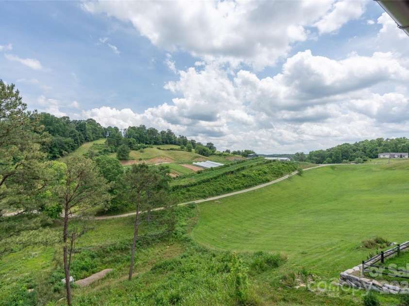 237 Westridge Farm Road, Asheville, NC 28804.  MLS# CAR4282360, YatesRealty ID 2663. Community green area from the right side of the back deck. 