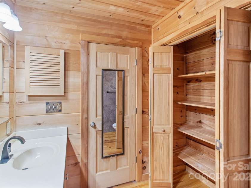 17 Aaron Way, Waynesville, NC 28786.  MLS# CAR4319469, YatesRealty ID 2664. Linen Closet in Primary Bathroom