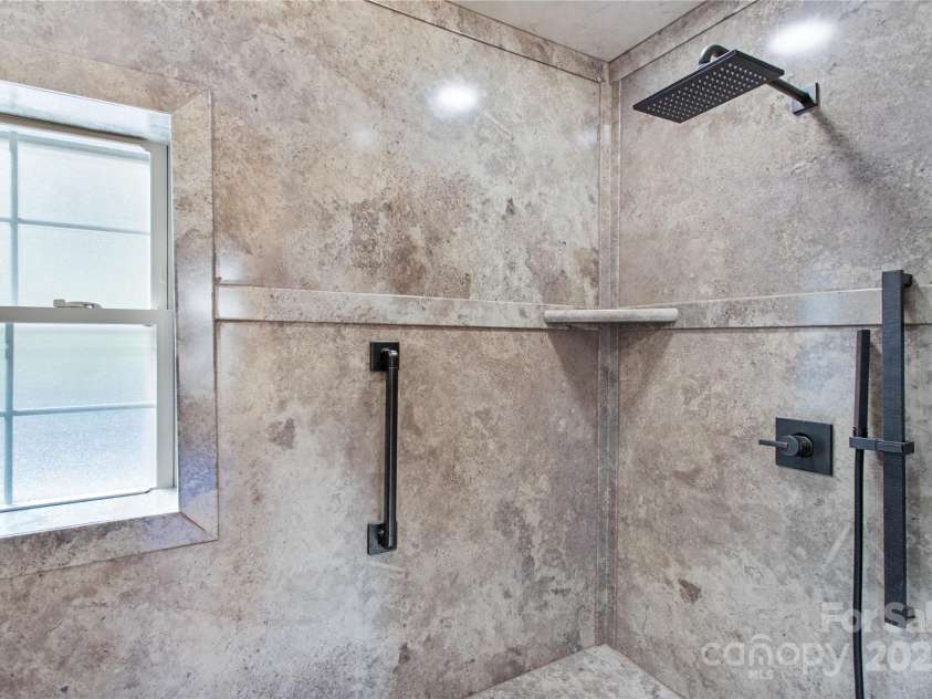17 Aaron Way, Waynesville, NC 28786.  MLS# CAR4319469, YatesRealty ID 2664. Walk In shower with built in seat