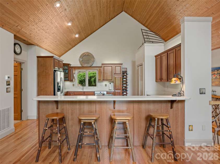26 Walnut Drive, Mills River, NC 28759.  MLS# CAR4369713, YatesRealty ID 26643. Kitchen with Bar seating