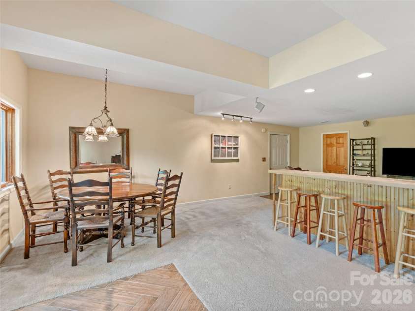 26 Walnut Drive, Mills River, NC 28759.  MLS# CAR4369713, YatesRealty ID 26643. Lower level Den with built in Bar/Counter space.