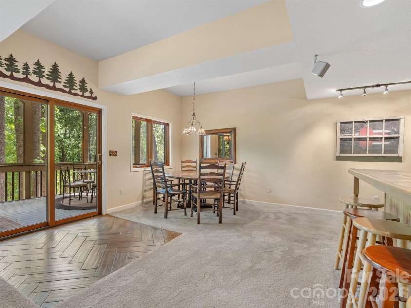 26 Walnut Drive, Mills River, NC 28759.  MLS# CAR4369713, YatesRealty ID 26643. Lower Level Den with Doors to screened porch