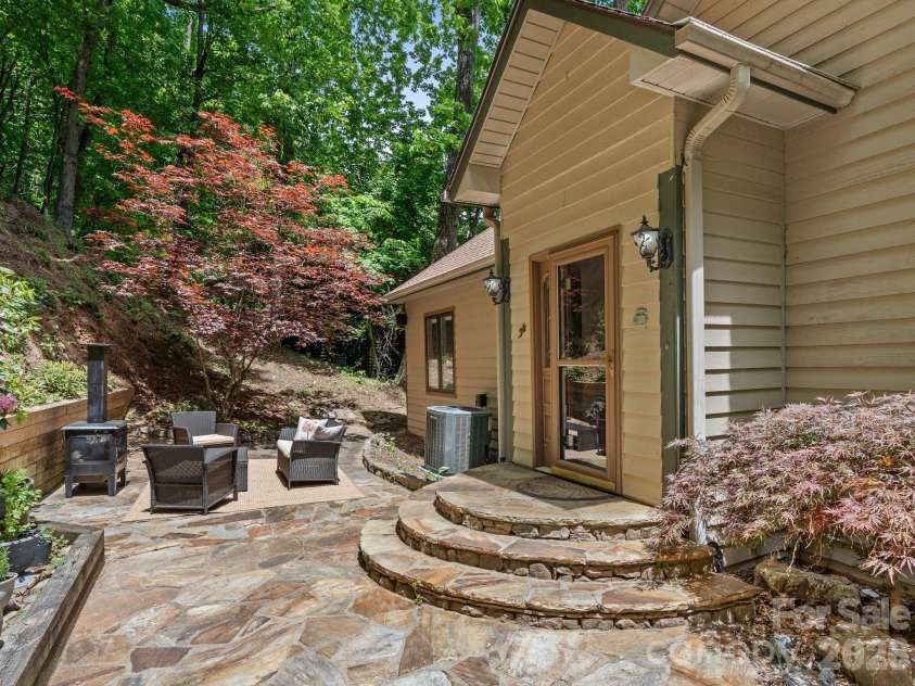 26 Walnut Drive, Mills River, NC 28759.  MLS# CAR4369713, YatesRealty ID 26643. Private Front Entry with Sitting Area and Slate Patio.