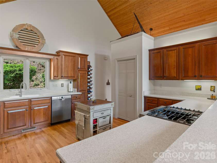 26 Walnut Drive, Mills River, NC 28759.  MLS# CAR4369713, YatesRealty ID 26643. Spacious Kitchen with Cherry Cabinets and Updated SS Appliances.