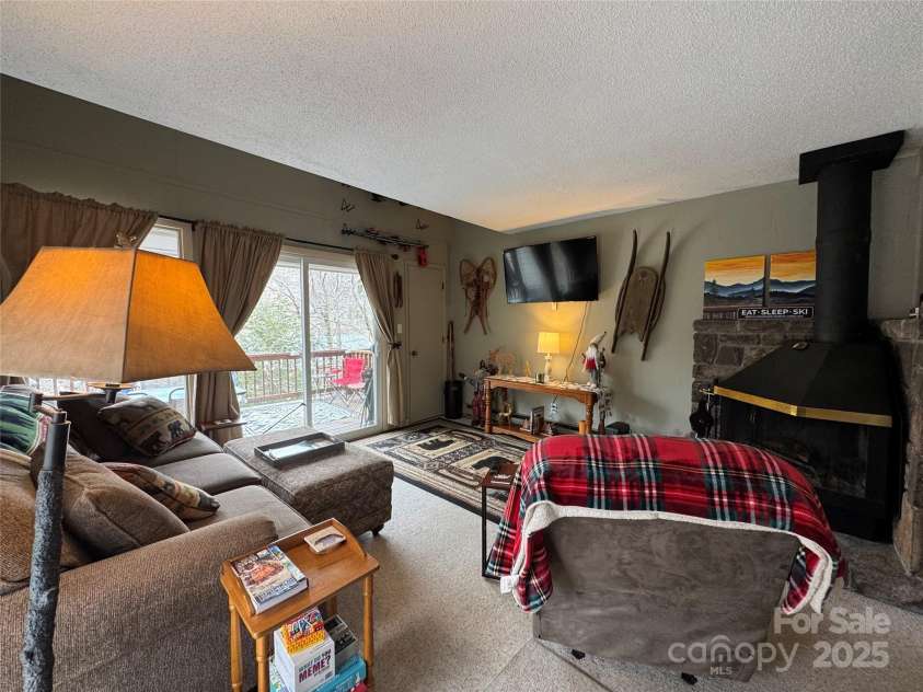 229 Birchwood Lane, Beech Mountain, NC 28604.  MLS# CAR4234563, YatesRealty ID 2665. Cozy family room