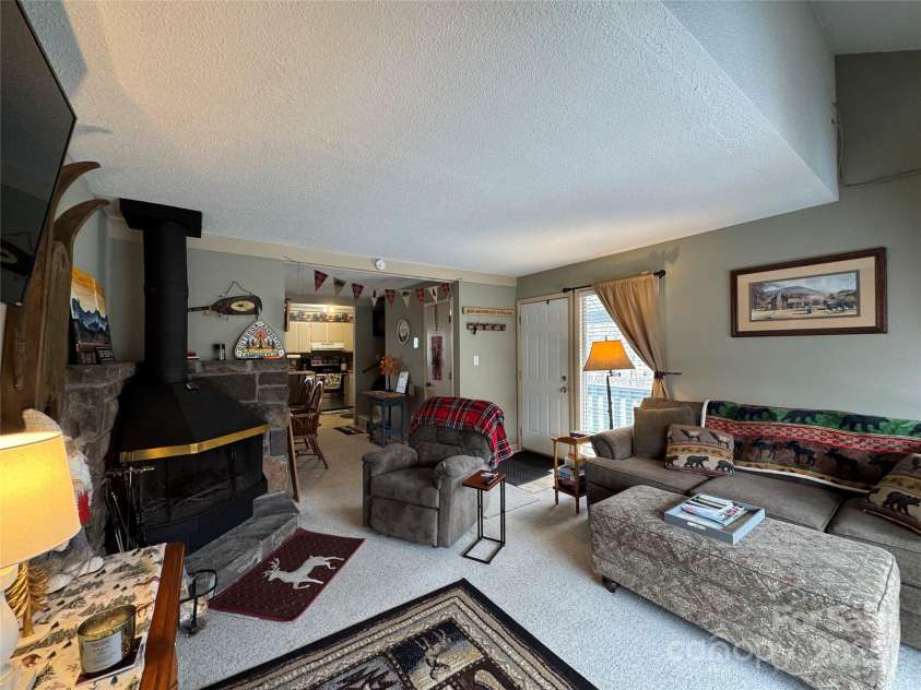 229 Birchwood Lane, Beech Mountain, NC 28604.  MLS# CAR4234563, YatesRealty ID 2665. Cozy family room