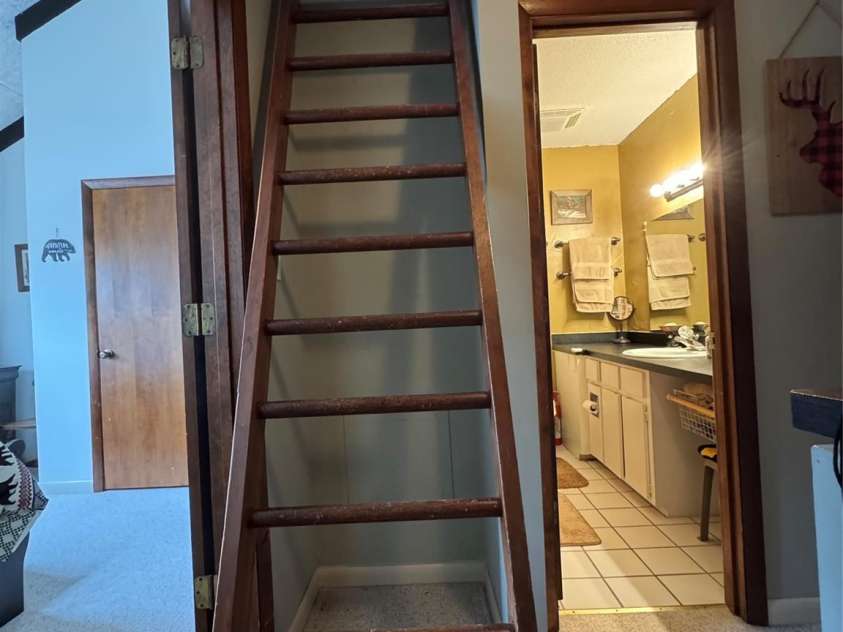 229 Birchwood Lane, Beech Mountain, NC 28604.  MLS# CAR4234563, YatesRealty ID 2665. Ladder leading to loft bedroom and half bath