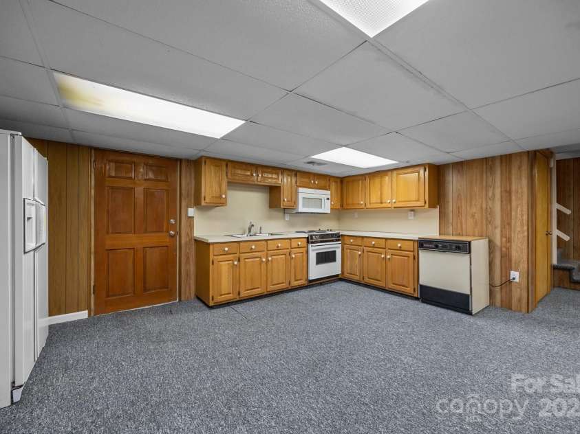 303 Jean Avenue, Kannapolis, NC 28083.  MLS# CAR4264386, YatesRealty ID 26651. Basement Door to Back yard