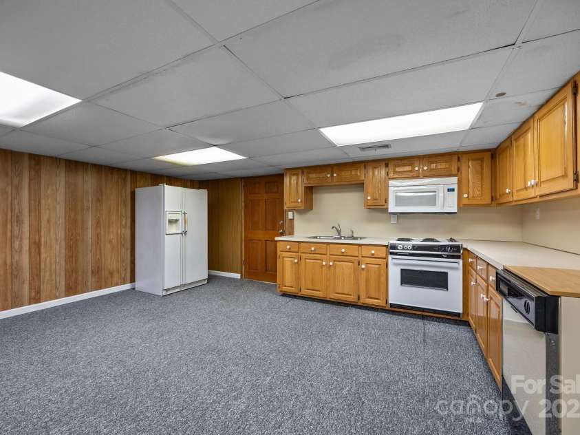 303 Jean Avenue, Kannapolis, NC 28083.  MLS# CAR4264386, YatesRealty ID 26651. Basement Kitchen